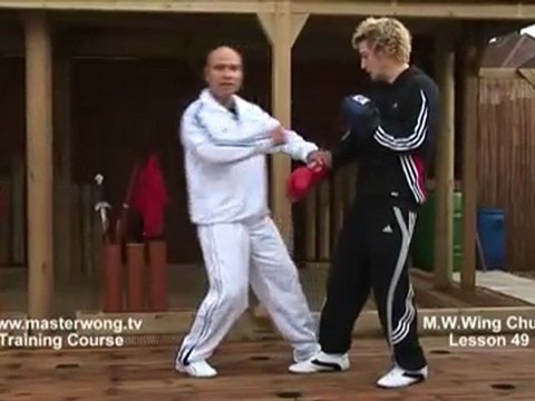 How to do Wing Chun Lesson 49- Block, cover and triple punch (Pad work)