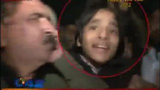 Reporter Smacks Kid With Mic At New Year's Celebration