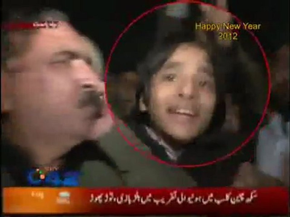 Reporter Smacks Kid With Mic At New Year's Celebration