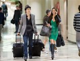 NINA DOBREV CARRIES HER AWARD AT LAX STILL WEARING PCAS DRESS AND HEADED HOME