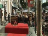 George Clooney presents West Wing producer John Wells with star on the Hollywood Walk of Fame