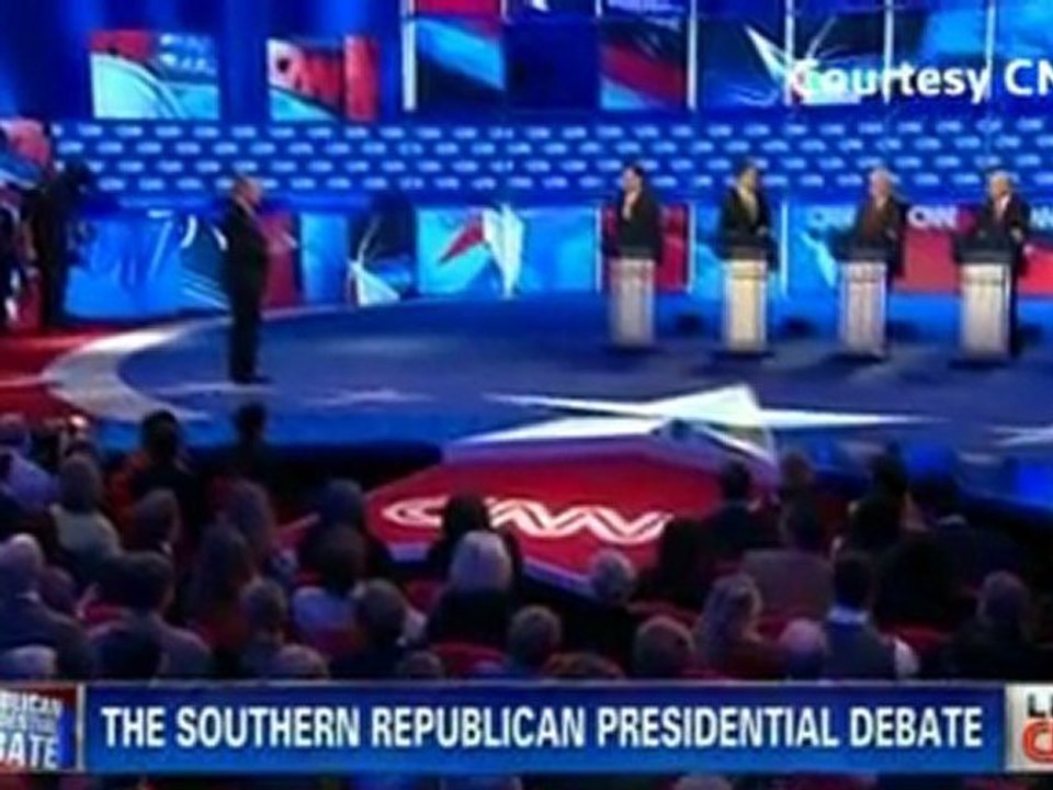 Republican rivals clash at raucous debate