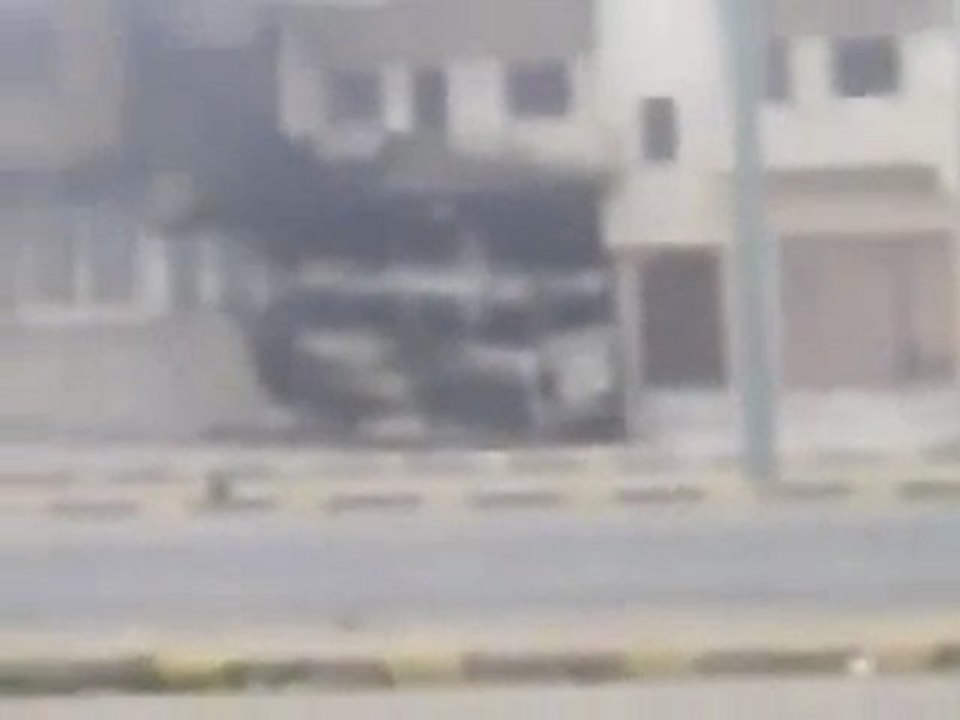 فري برس   حمص حي عشيرة استهداف باص نقل من قبل الجيش الاسدي22 1 2012