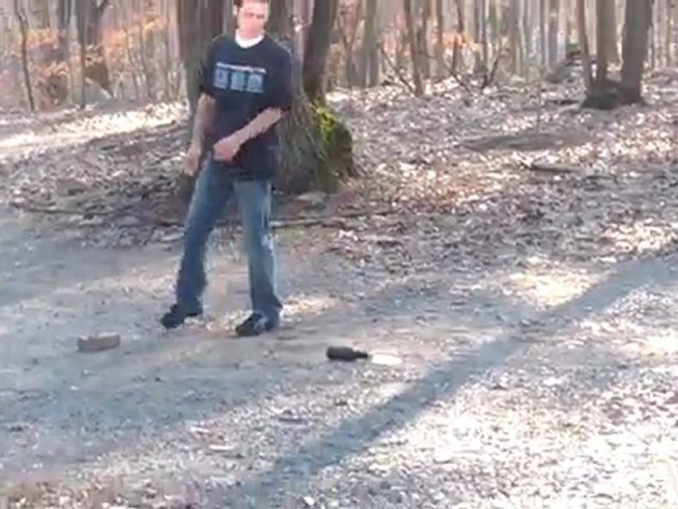 Idiot Gets Owned by Exploding Beer Bottle