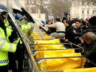 Download Video: Angry activists attack Syrian embassy in London