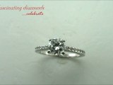 Round Cut Diamond Engagement Ring With Round Cut Side Stones In Prong Setting