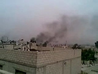 فري برس   ريف دمشق داريا تصاعد الدخان في سماء المدينة مع آذان العصر6 2 2012