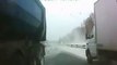 A truck out of control almost smashes a car on a snowy road in Russia