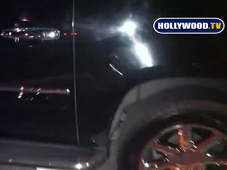 Paris Hilton Runs For Her Escalade.