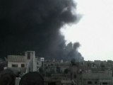 Smoke fills the air near Homs