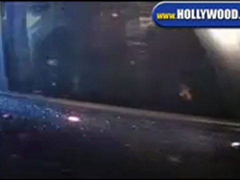 Lindsay Lohan Falls Over While Leaving Villa.