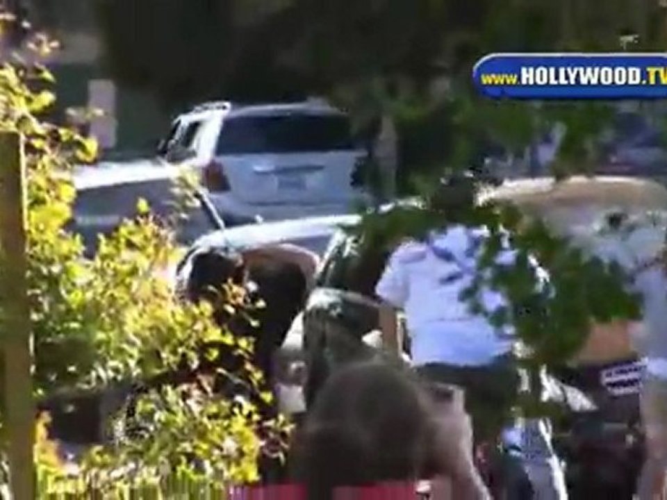 Jack Black clowns with Paparazzi on his bike