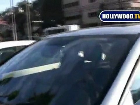 Ashley Tisdale Covers Up After Her Tanning Session