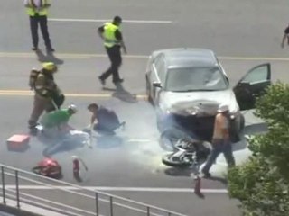 Crowd Lifts Burning Car
