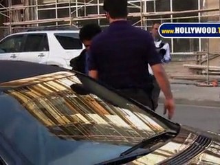 Katie Holmes' Bodyguard Wards Off Stranger Approaching Her Car in Street