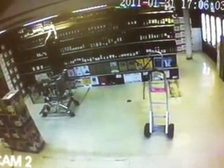 Wine shelf collapses on clerk