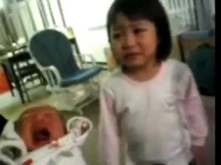 Little girl loves baby sister!