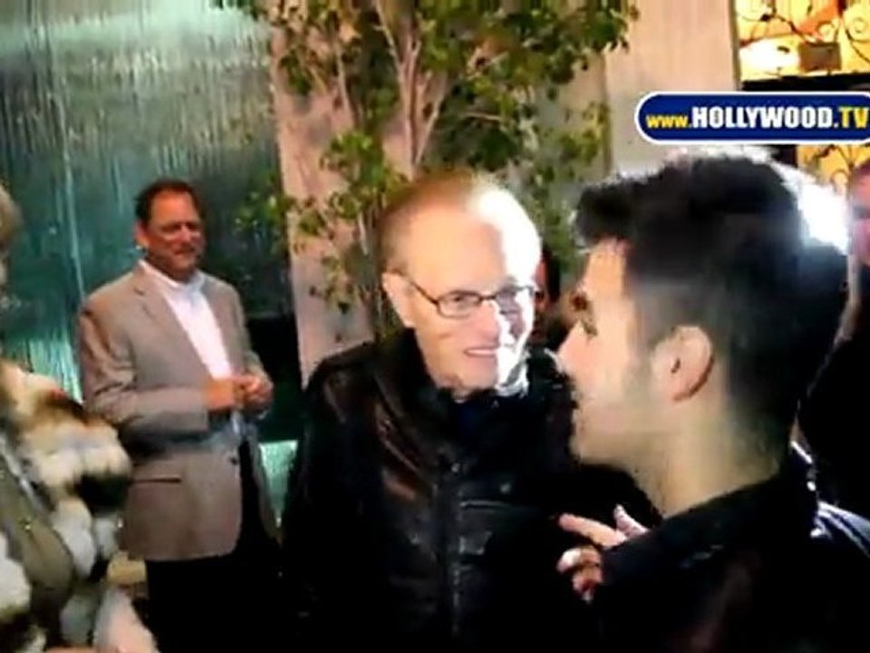 Larry King Greets Joe Jonas at Mastros Steakhouse