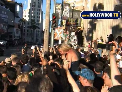 Leonardo DiCaprio Signs Autographs For Fans On Hollywood Blvd