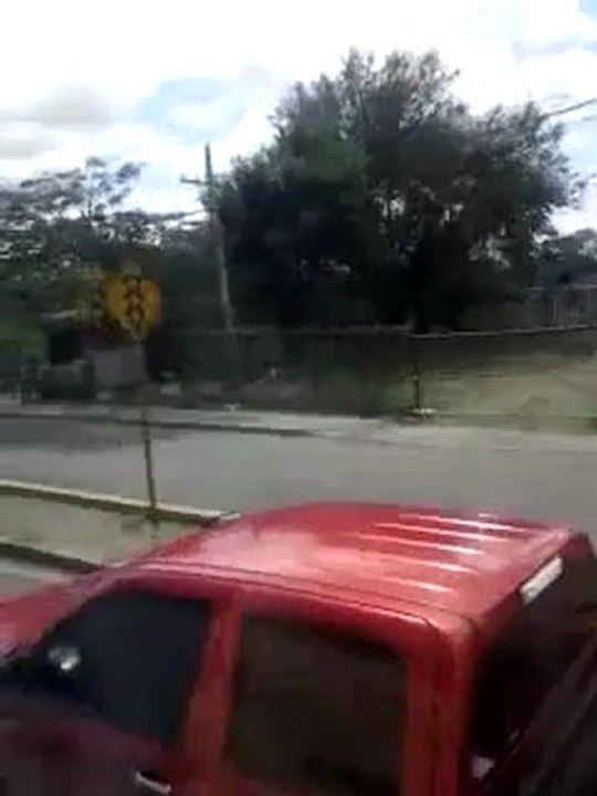 Passing through Santiago, Dominican Republic, on a Metrobus.