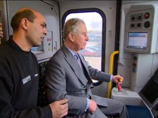 Prince Charles drives a train