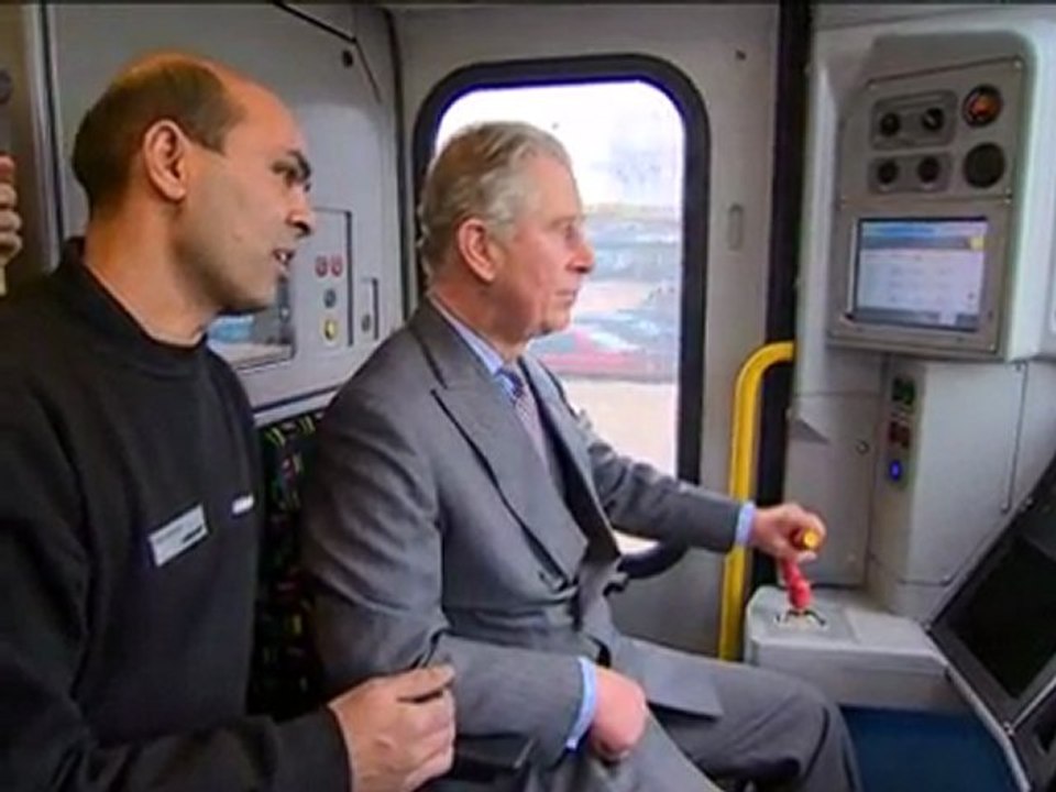Prince Charles drives a train