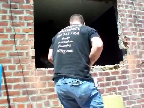 Bullfrog Builders Carefully Removes Brick Wall to Install Sliding Doors