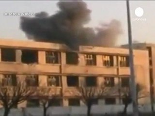 Suriye'de referandum ve çatışma görüntüleri bir arada