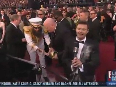 Sacha Baron Cohen Pours Ashes on Ryan Seacrest