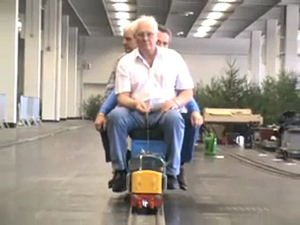 Cologne Livesteam Meeting 2008 British Diesel Loco is approaching with  one engineer and two passengers