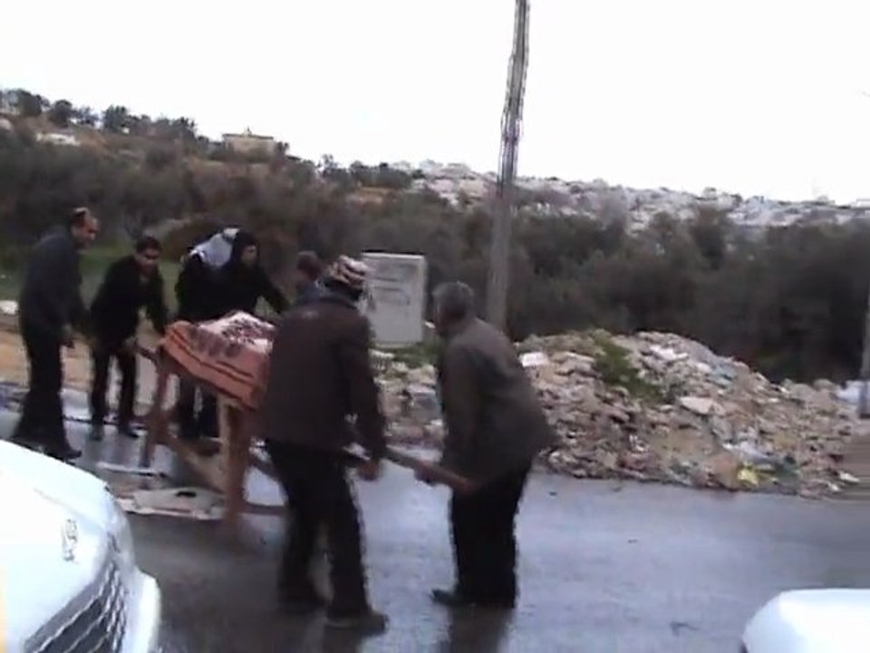 Israeli security forces spray foul smelling liquid on a funeral procession in Hebron