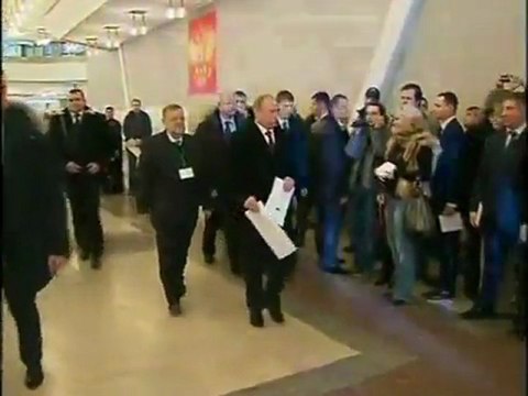 Vladimir Putin casts his ballot