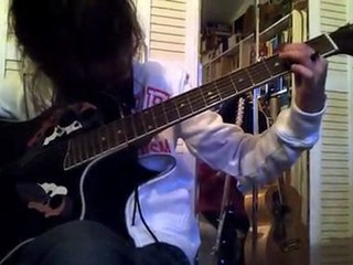 Cloé plays acoustic guitar