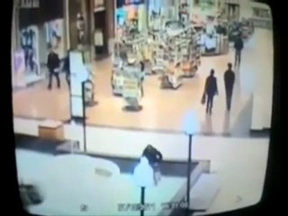 Girl falls in mall fountain while texting