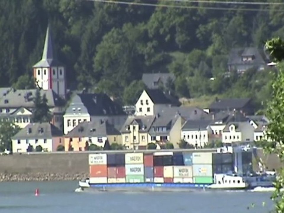 Trains on both rhine lines and ships at the small town of kestert beside the rhine