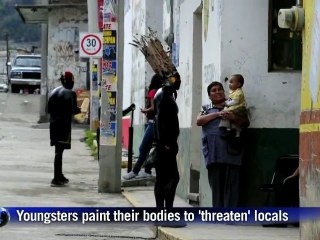 Youths painted in black for Mexican carnival