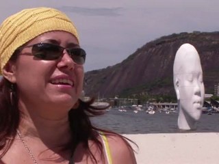 A giant head emerges from the ocean in Rio