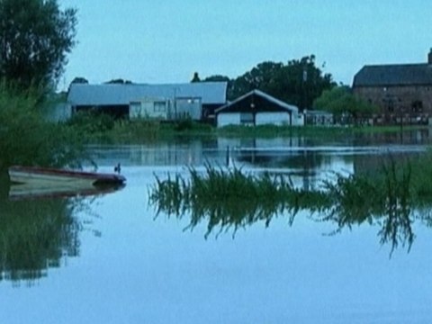 Britain gale-battered, flooded