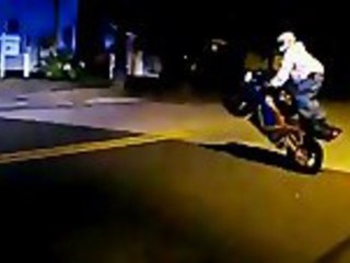 Guy performs some motorcycle stunts before fleeing police