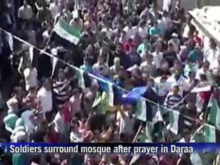 Syria towns under fire as thousands protest