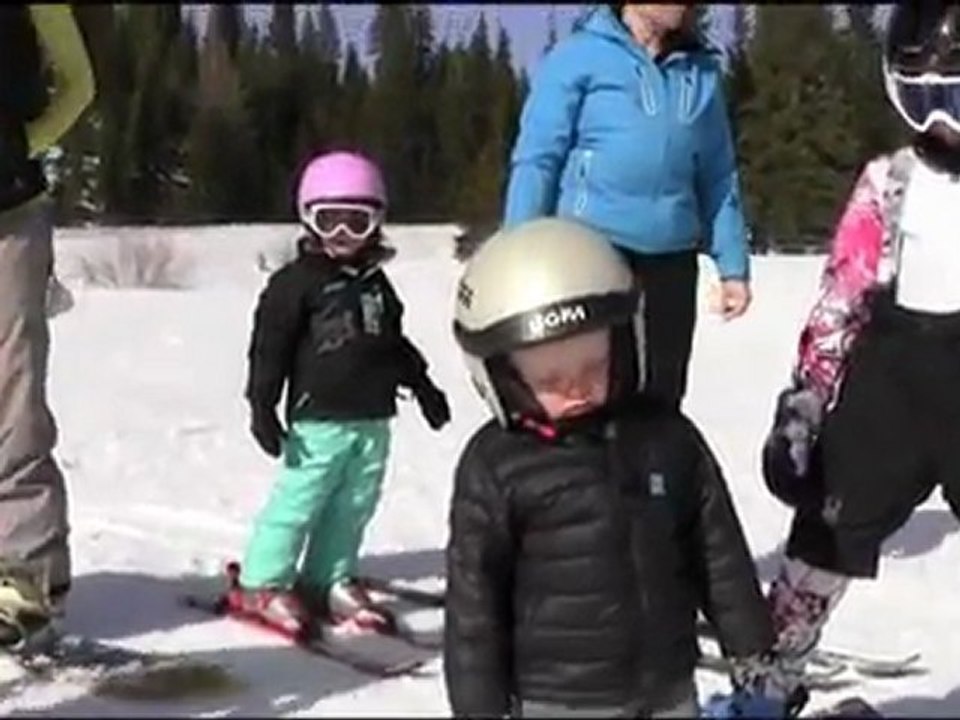 Little boy sleeping while skiing