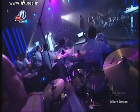 S.Orhan O.Şan Mavi yelek mor düğme TRT