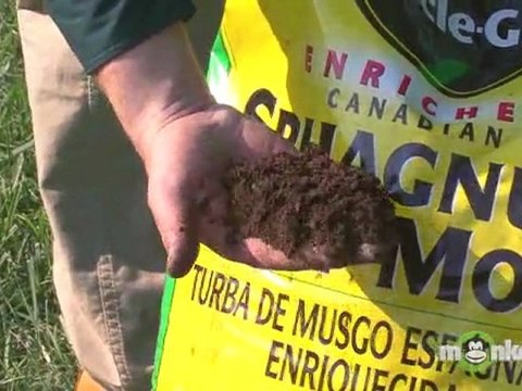 Adding Garden Soil Compost to a Raised Garden Bed