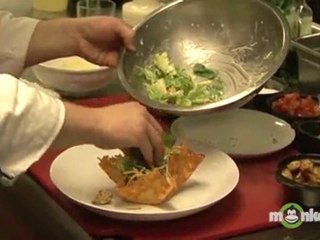 Arranging Finished Caesar Salad in Parmesan Basket