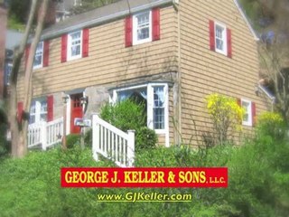 Vinyl Cedar Shake Siding on a Bay Window