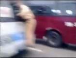 Vietnamese traffic cop clings on to moving bus