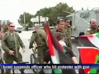 Israel suspends officer who hit protester with gun