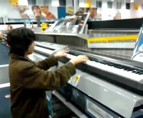 Kid Plays Super Mario Theme