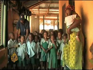 Heavy burdens meet Ghanians moving south - 2 March 09