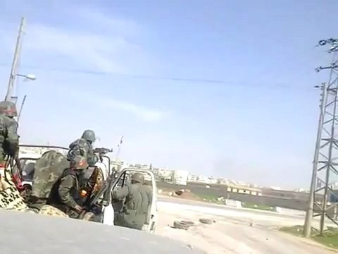 Syria - Aleppo - Andan - 20120408 - Asadi soldier films gunfire from FSA defending Andan